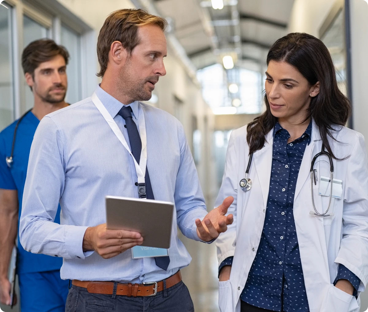 Healthcare team in hallway discussion