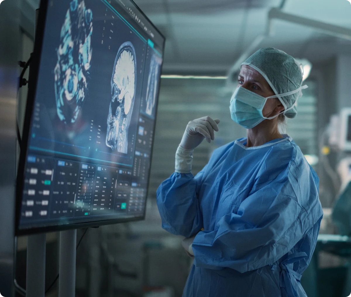 Medical professional reviewing digital brain images