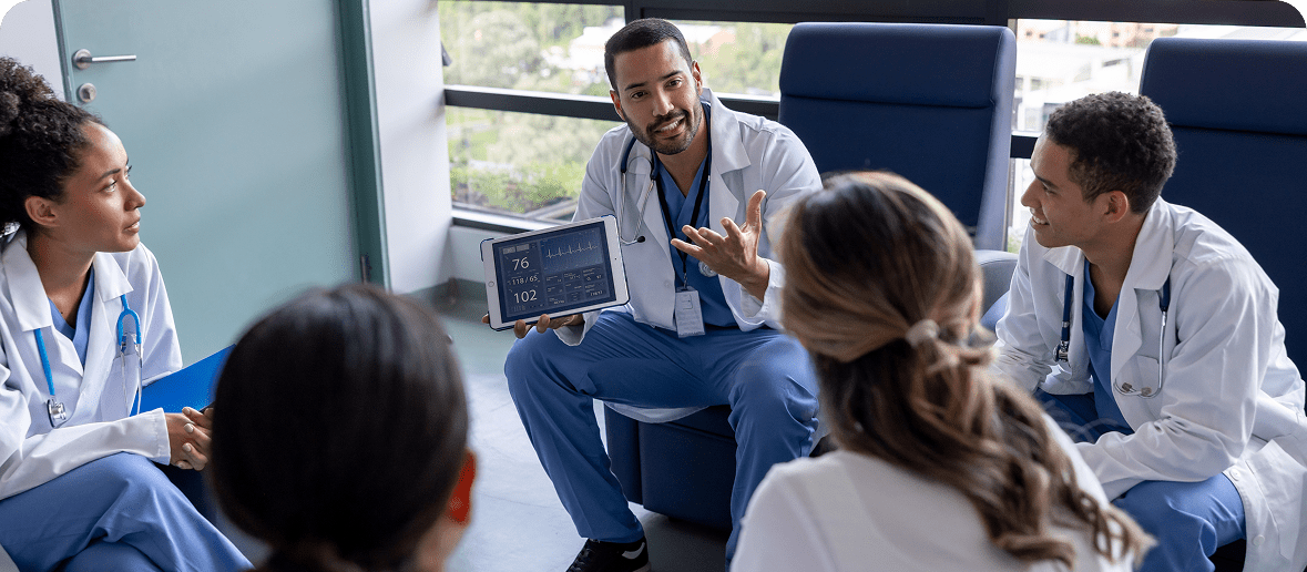 Medical team reviewing information on a tablet